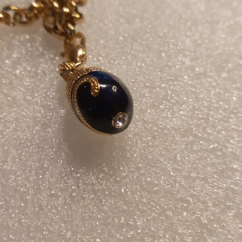 Faberge egg charm bracelet on a gold tone rolo chain. - Picture 6 of 16